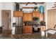 Modern kitchen with stainless steel appliances and wood cabinets at 185 Rotonda E Blvd, Rotonda West, FL 33947