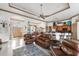 Open floor plan living area with leather furniture and high ceilings at 185 Rotonda E Blvd, Rotonda West, FL 33947