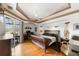 Large main bedroom with hardwood floors and sliding glass doors at 185 Rotonda E Blvd, Rotonda West, FL 33947