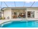 Stunning view of the pool and patio from inside the home at 185 Rotonda E Blvd, Rotonda West, FL 33947