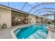 Expansive pool and patio with access to interior living space at 185 Rotonda E Blvd, Rotonda West, FL 33947