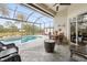 Spacious pool and patio area with seating at 185 Rotonda E Blvd, Rotonda West, FL 33947