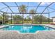 Relaxing pool area with a screened enclosure at 185 Rotonda E Blvd, Rotonda West, FL 33947