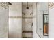Walk-in shower with double shower heads and tiled walls at 185 Rotonda E Blvd, Rotonda West, FL 33947