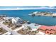 Aerial view of waterfront property, showcasing house and neighboring houses at 1924 Mississippi Ave, Englewood, FL 34224
