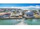 Waterfront property with neighboring homes, under construction house visible at 1924 Mississippi Ave, Englewood, FL 34224