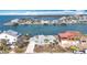 Aerial view of a waterfront home with a nicely landscaped yard at 1924 Mississippi Ave, Englewood, FL 34224