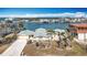 Aerial shot of waterfront home with landscaped yard and canal access at 1924 Mississippi Ave, Englewood, FL 34224