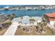 Aerial view of waterfront home with landscaped yard and canal access at 1924 Mississippi Ave, Englewood, FL 34224