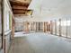Large bedroom under renovation, featuring high ceilings and new flooring at 1924 Mississippi Ave, Englewood, FL 34224
