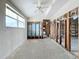 Large bedroom under renovation with high ceilings and new flooring at 1924 Mississippi Ave, Englewood, FL 34224