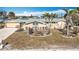 House exterior showcasing a well-maintained lawn and waterfront view at 1924 Mississippi Ave, Englewood, FL 34224