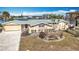 House exterior showcasing a well-maintained lawn and waterfront view at 1924 Mississippi Ave, Englewood, FL 34224