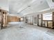 Under renovation, large living area with exposed ceiling beams and high ceilings at 1924 Mississippi Ave, Englewood, FL 34224