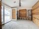 A living room under construction, showcasing the new window and entryway at 1924 Mississippi Ave, Englewood, FL 34224