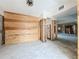 A living room undergoing renovation, with exposed framing and new flooring at 1924 Mississippi Ave, Englewood, FL 34224