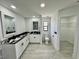 Elegant bathroom with white cabinets, granite countertops, and modern fixtures at 19782 Midway Blvd, Port Charlotte, FL 33948