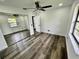 Bright bedroom with mirrored closet doors and wood-look flooring at 19782 Midway Blvd, Port Charlotte, FL 33948