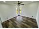 Charming bedroom with two windows and ceiling fan at 19782 Midway Blvd, Port Charlotte, FL 33948