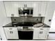 Modern kitchen with stainless steel appliances and dark granite countertops at 19782 Midway Blvd, Port Charlotte, FL 33948