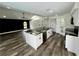 Modern kitchen with a large island, white cabinets, and granite countertops at 19782 Midway Blvd, Port Charlotte, FL 33948