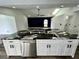 Large kitchen island with granite countertop and stainless steel dishwasher at 19782 Midway Blvd, Port Charlotte, FL 33948