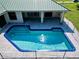 Inviting blue pool with surrounding patio at 19782 Midway Blvd, Port Charlotte, FL 33948