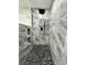 Large walk-in shower with pebble stone floor and rainfall shower head at 19782 Midway Blvd, Port Charlotte, FL 33948