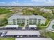 Aerial view of a community with building, parking, and landscaping at 2121 Heron Lake Dr # 301, Punta Gorda, FL 33983