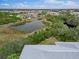 Landscape view of pond and rooftops at 2121 Heron Lake Dr # 301, Punta Gorda, FL 33983