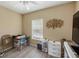 Small bedroom with window, a desk and storage at 2121 Heron Lake Dr # 301, Punta Gorda, FL 33983