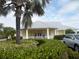 Community clubhouse with landscaping and parking at 2121 Heron Lake Dr # 301, Punta Gorda, FL 33983