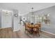 Open concept dining area with wood table and kitchen view at 2121 Heron Lake Dr # 301, Punta Gorda, FL 33983