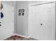 Bright entryway with two white doors and gray walls at 2121 Heron Lake Dr # 301, Punta Gorda, FL 33983