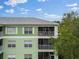 Close-up of building exterior showing screened balconies at 2121 Heron Lake Dr # 301, Punta Gorda, FL 33983