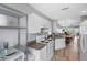 Well-equipped kitchen featuring white cabinets and modern appliances at 2121 Heron Lake Dr # 301, Punta Gorda, FL 33983