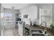 Kitchen with white cabinets and stainless steel appliances at 2121 Heron Lake Dr # 301, Punta Gorda, FL 33983