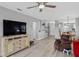 Living room with red couch and view of dining area at 2121 Heron Lake Dr # 301, Punta Gorda, FL 33983