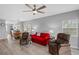 Living room with red couch and two brown recliners at 2121 Heron Lake Dr # 301, Punta Gorda, FL 33983