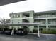 Condo building with covered parking and landscaping at 2121 Heron Lake Dr # 301, Punta Gorda, FL 33983