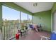 Relaxing screened balcony overlooking lush greenery at 2121 Heron Lake Dr # 301, Punta Gorda, FL 33983