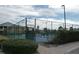 Blue tennis courts with fencing and gate at 2121 Heron Lake Dr # 301, Punta Gorda, FL 33983