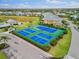Aerial view of community tennis/pickleball courts at 2121 Heron Lake Dr # 301, Punta Gorda, FL 33983