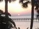 Stunning sunset view over the water with a pier at 2121 Heron Lake Dr # 301, Punta Gorda, FL 33983