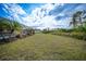 Backyard with pool and spacious grassy area at 215 Australian Dr, Rotonda West, FL 33947