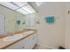 Double vanity, medicine cabinets, and ample counter space at 215 Australian Dr, Rotonda West, FL 33947