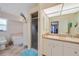 Bathroom with double vanity, shower, and corner jacuzzi tub at 215 Australian Dr, Rotonda West, FL 33947