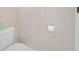 Simple and clean bathroom with toilet and wall mounted toilet paper holder at 215 Australian Dr, Rotonda West, FL 33947