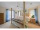 King-size bed, dresser, and large windows offering natural light at 215 Australian Dr, Rotonda West, FL 33947