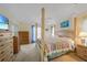 Spacious bedroom with king-size bed, dresser, and plenty of natural light at 215 Australian Dr, Rotonda West, FL 33947